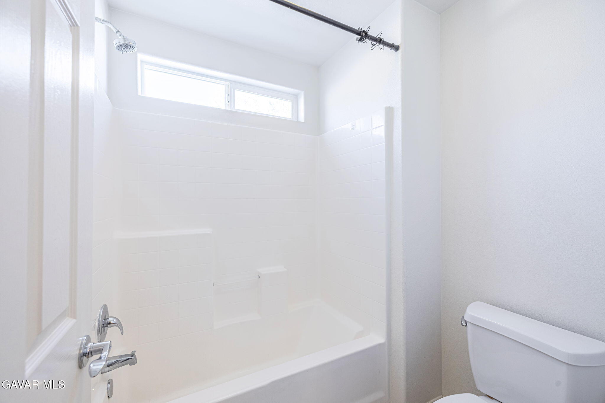 2400 Sunset Ridge Drive Rosamond, CA 93560 - Photo 20 of 34 a bathroom with a shower and a toilet