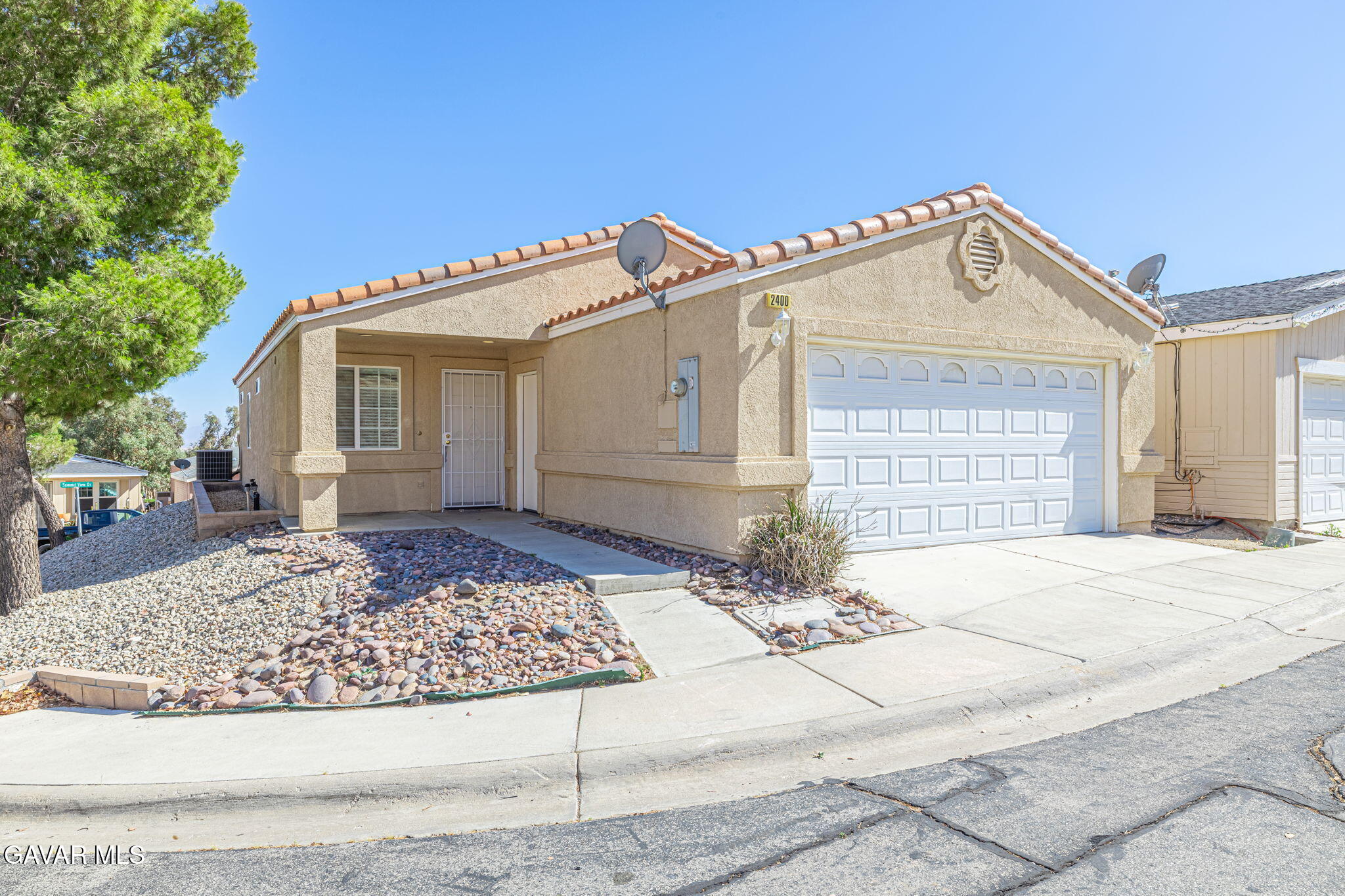 2400 Sunset Ridge Drive Rosamond, CA 93560 - Photo 2 of 34 a view of a white house with a outdoor space