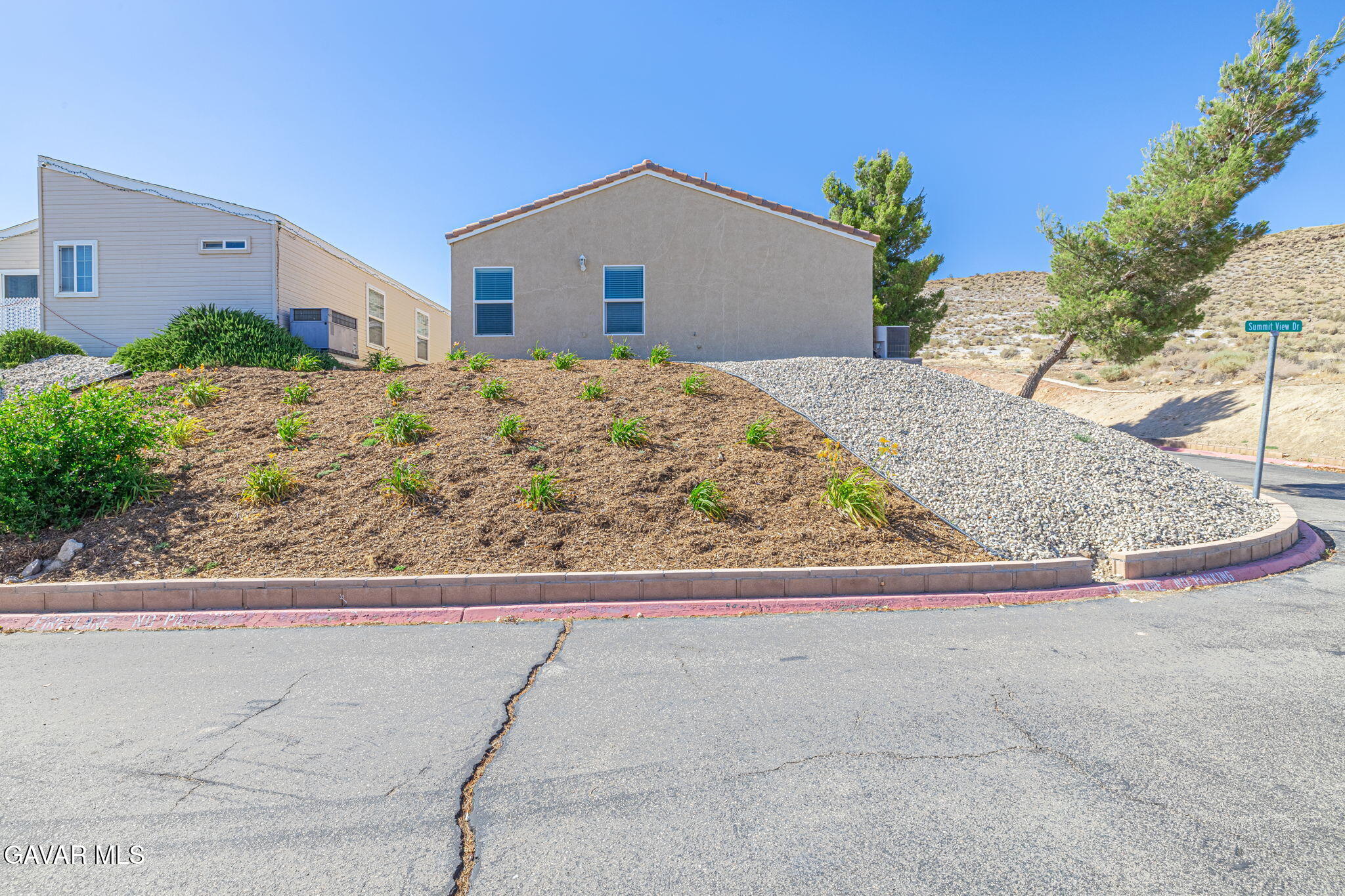 2400 Sunset Ridge Drive Rosamond, CA 93560 - Photo 32 of 34 a front view of a house with garage