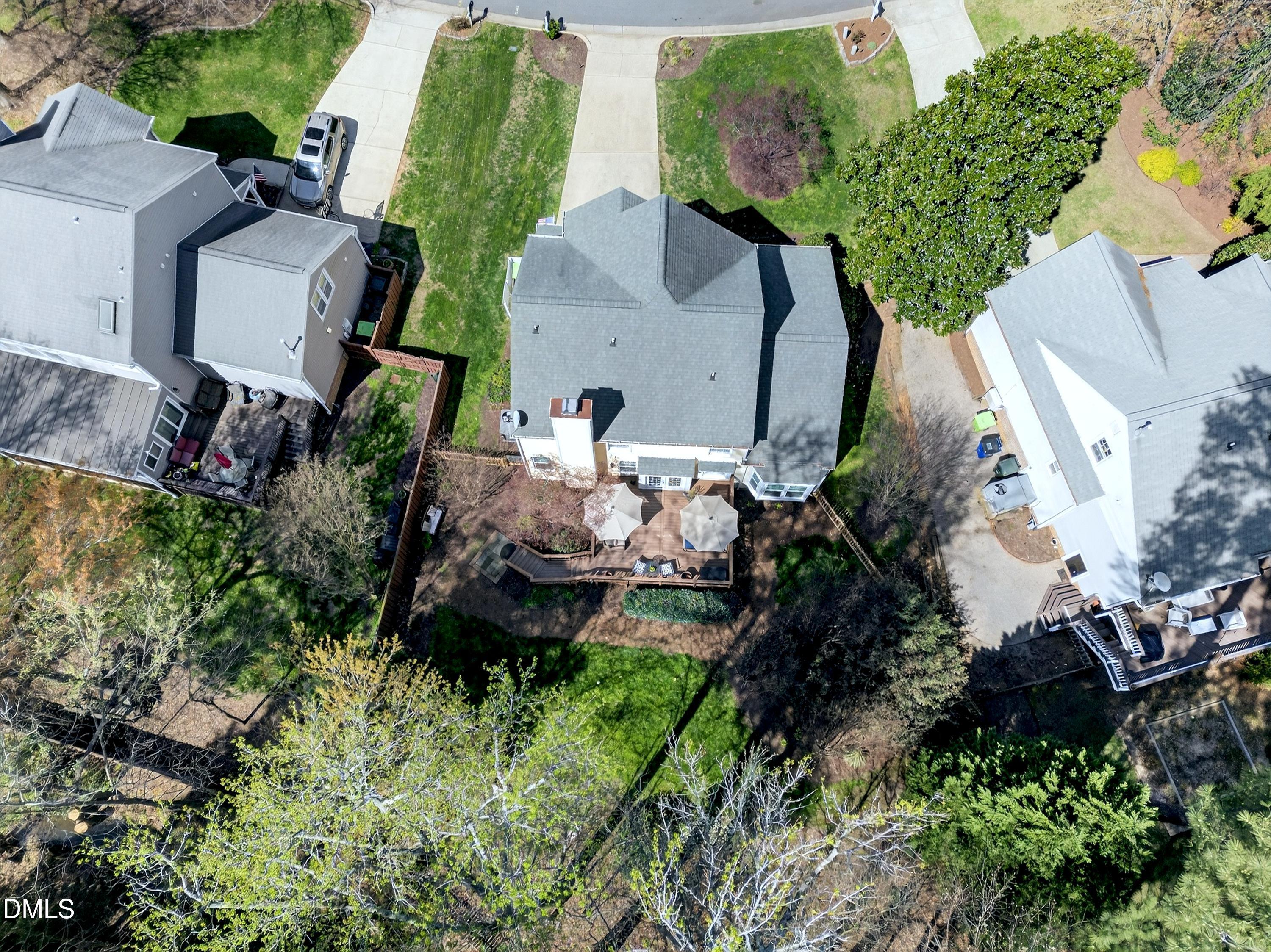 9432 Cartersville Court Raleigh, NC 27617 - Photo 51 of 66 an aerial view of a house with a yard and garden