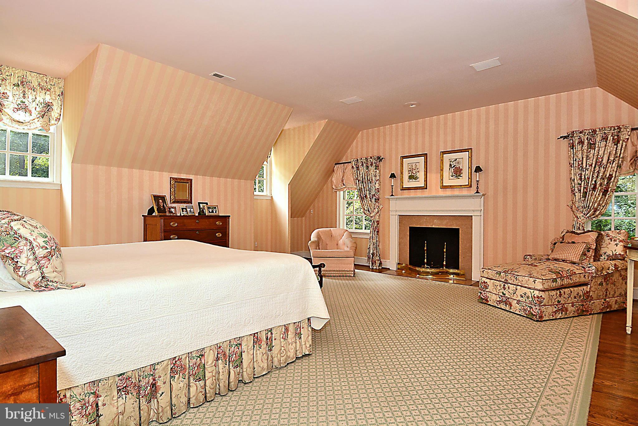 8741 Persimmon Tree Road Potomac, MD 20854 - Photo 15 of 30 Master bedroom w/ hardwoods & FP