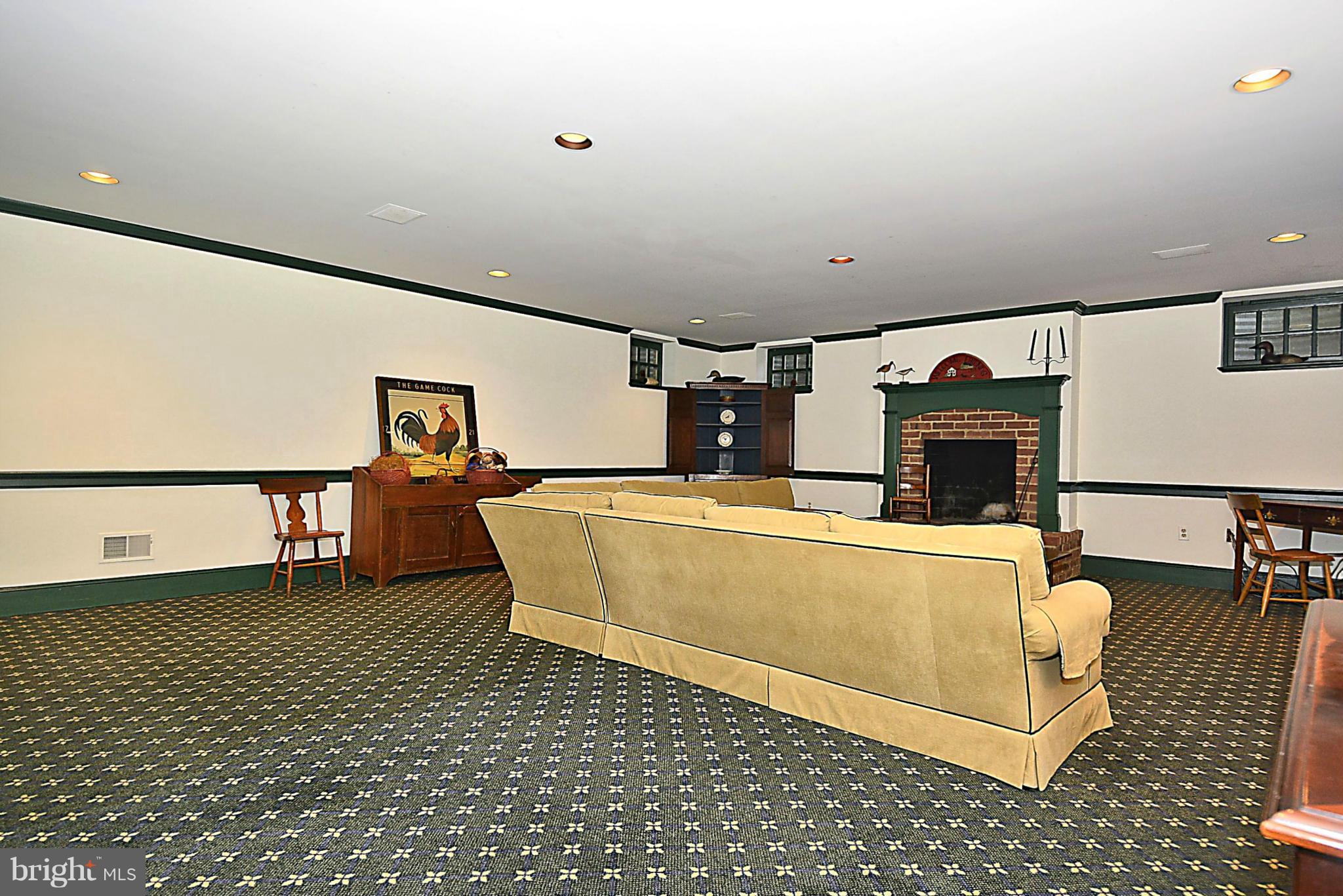 8741 Persimmon Tree Road Potomac, MD 20854 - Photo 24 of 30 Lower level rec room w/ FP