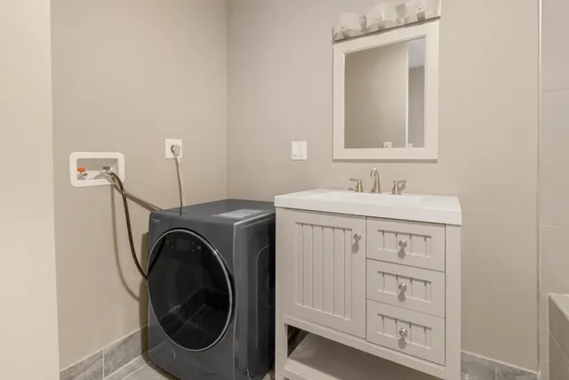 a bathroom with a sink a mirror and a bathtub