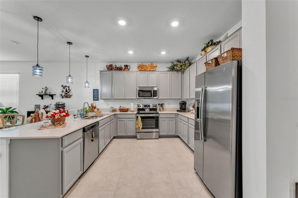 280 Pershing Street Bartow, FL 33830 - Photo 11 of 41 a kitchen with refrigerator a sink and cabinets