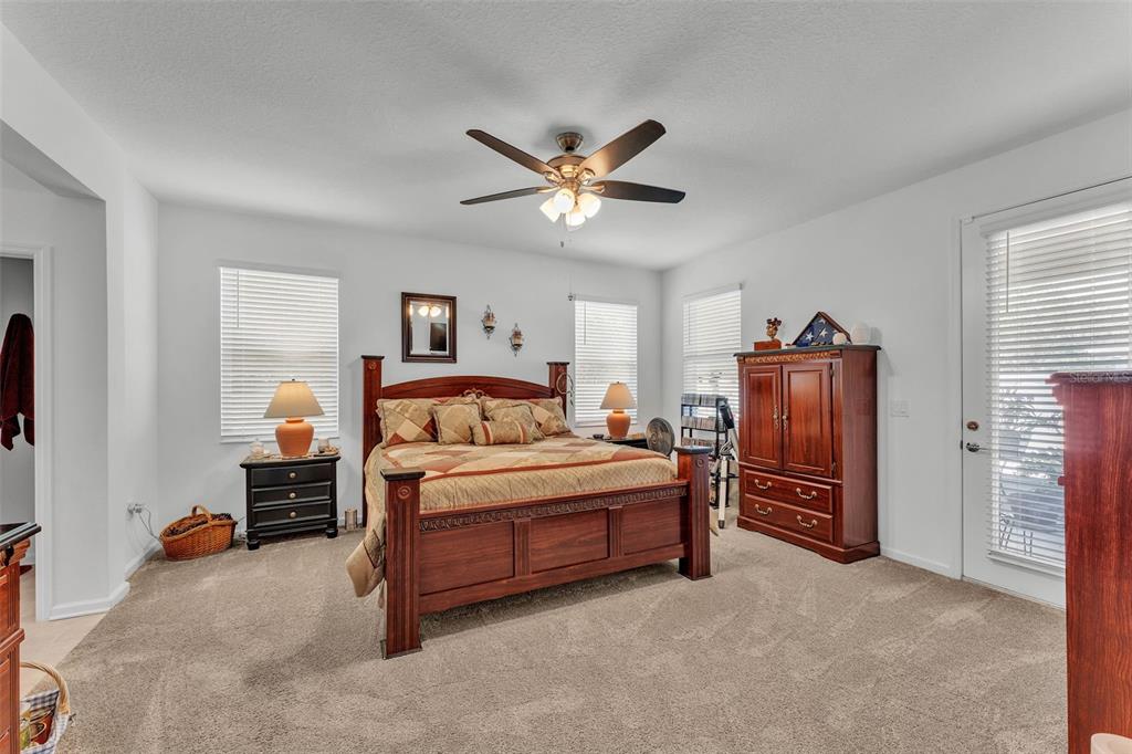 280 Pershing Street Bartow, FL 33830 - Photo 19 of 41 a bedroom with a bed and a chandelier
