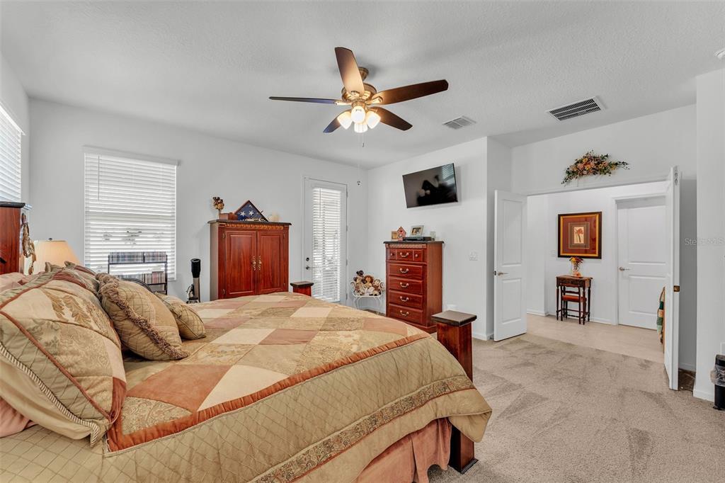 280 Pershing Street Bartow, FL 33830 - Photo 20 of 41 a bedroom with a bed dresser and a ceiling fan