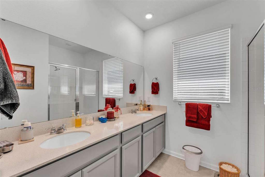 280 Pershing Street Bartow, FL 33830 - Photo 23 of 41 a bathroom with a double vanity sink mirror and toilet