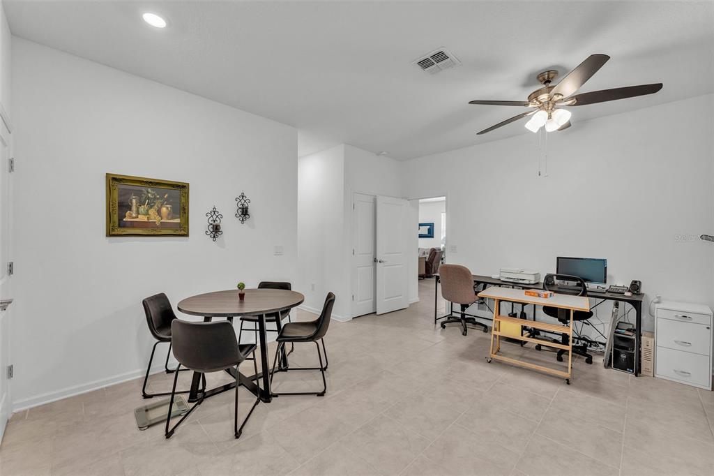 280 Pershing Street Bartow, FL 33830 - Photo 27 of 41 a view of a workspace with furniture and a ceiling fan
