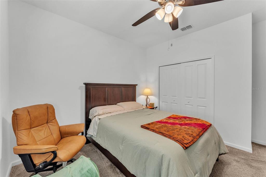 280 Pershing Street Bartow, FL 33830 - Photo 32 of 41 a bedroom with a bed and chair