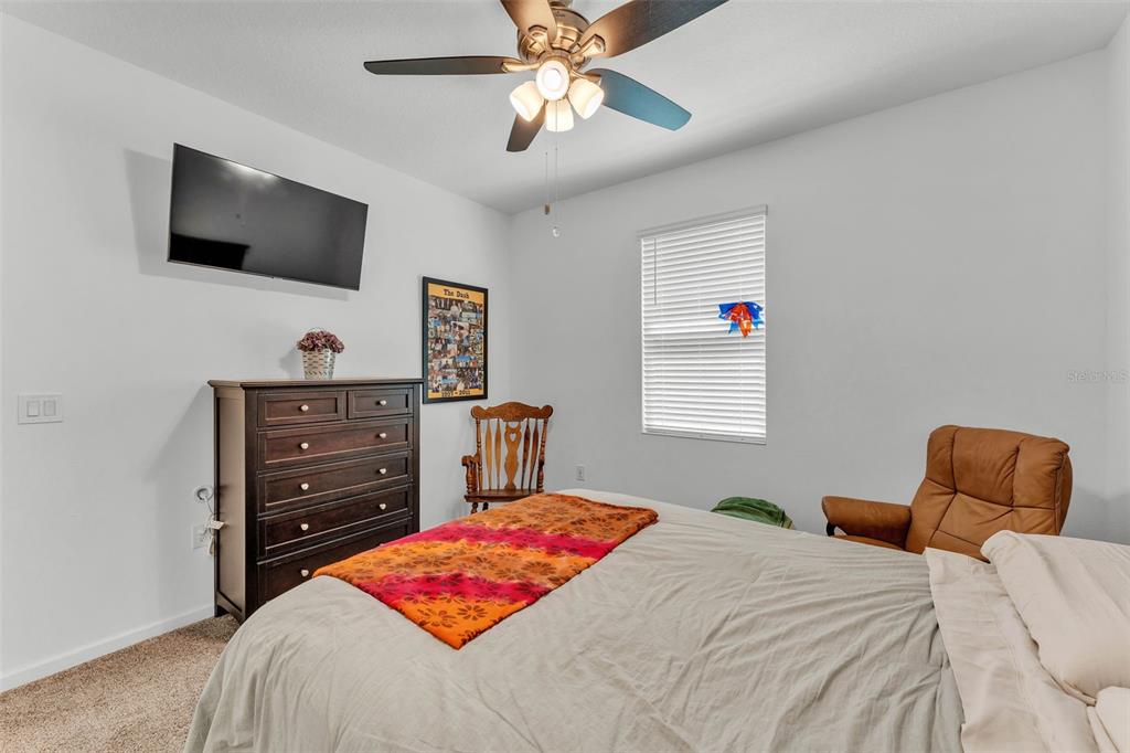 280 Pershing Street Bartow, FL 33830 - Photo 33 of 41 a bedroom with a bed and a flat screen tv