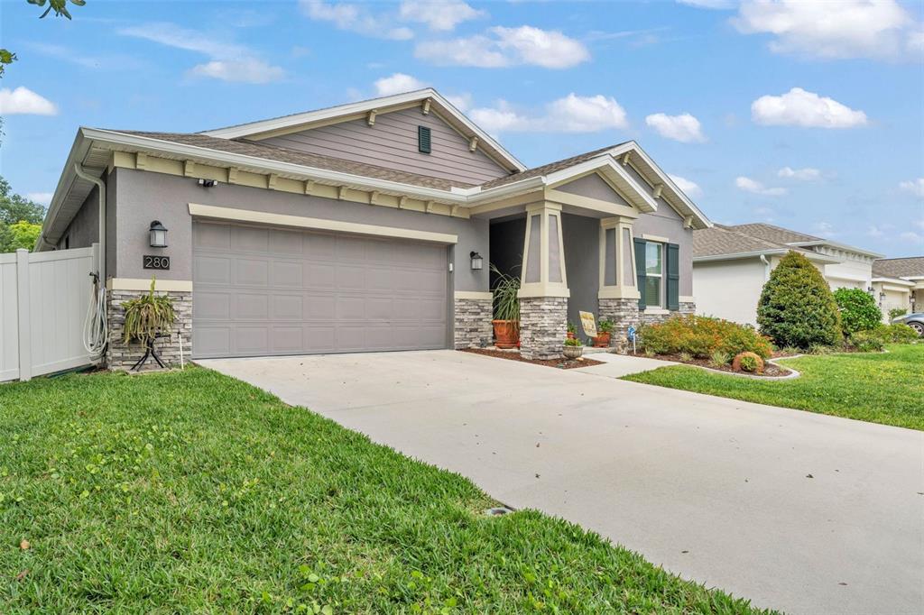 280 Pershing Street Bartow, FL 33830 - Photo 38 of 41 a front view of a house with a yard and garage