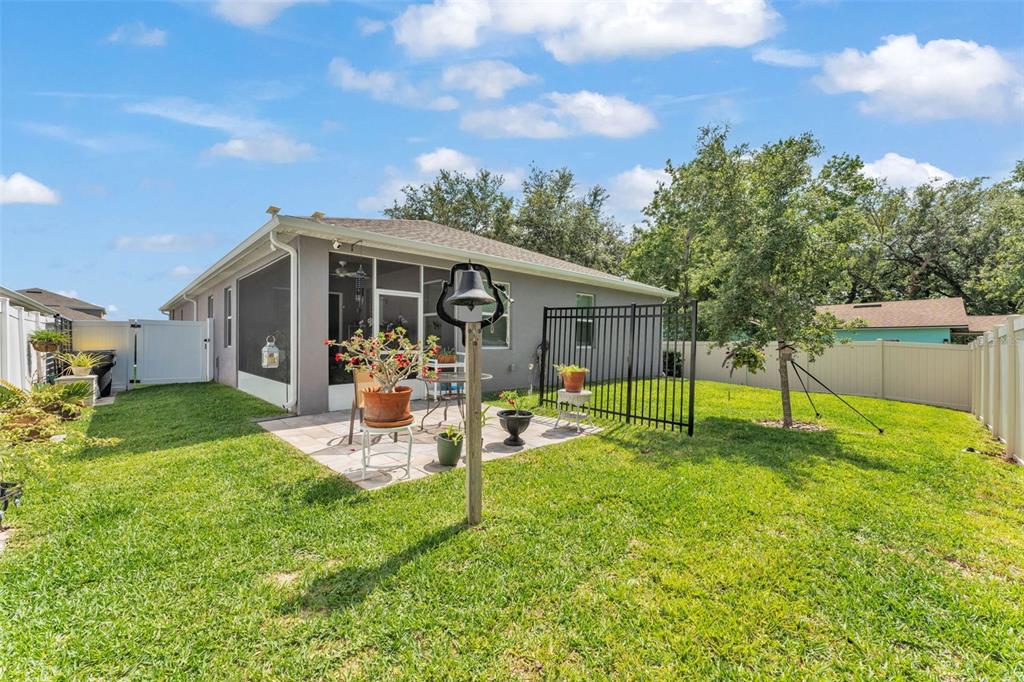 280 Pershing Street Bartow, FL 33830 - Photo 40 of 41 a view of a house with a backyard and a patio