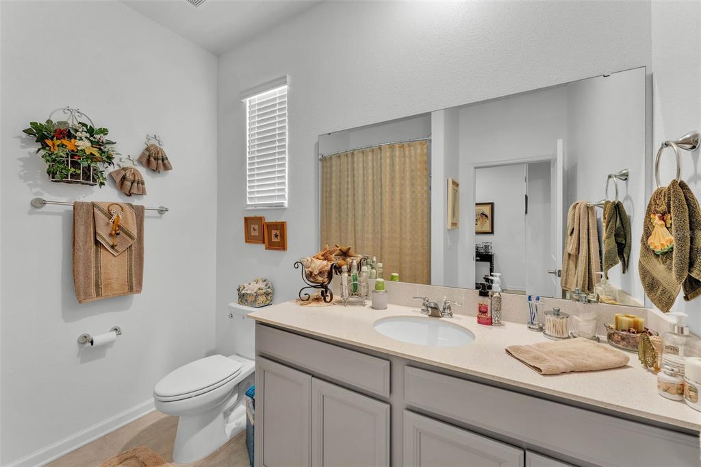 280 Pershing Street Bartow, FL 33830 - Photo 4 of 41 a bathroom with a toilet sink and mirror