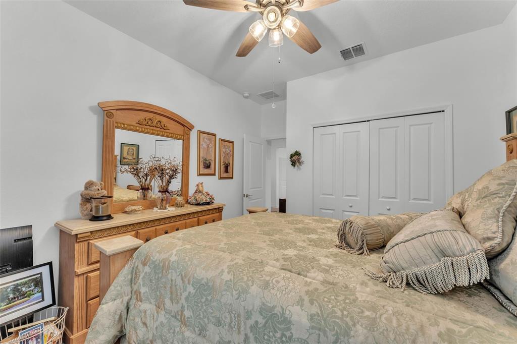 280 Pershing Street Bartow, FL 33830 - Photo 6 of 41 a bedroom with a bed and a chandelier