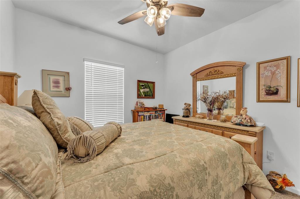 280 Pershing Street Bartow, FL 33830 - Photo 7 of 41 a bed room with a bed and a chandelier
