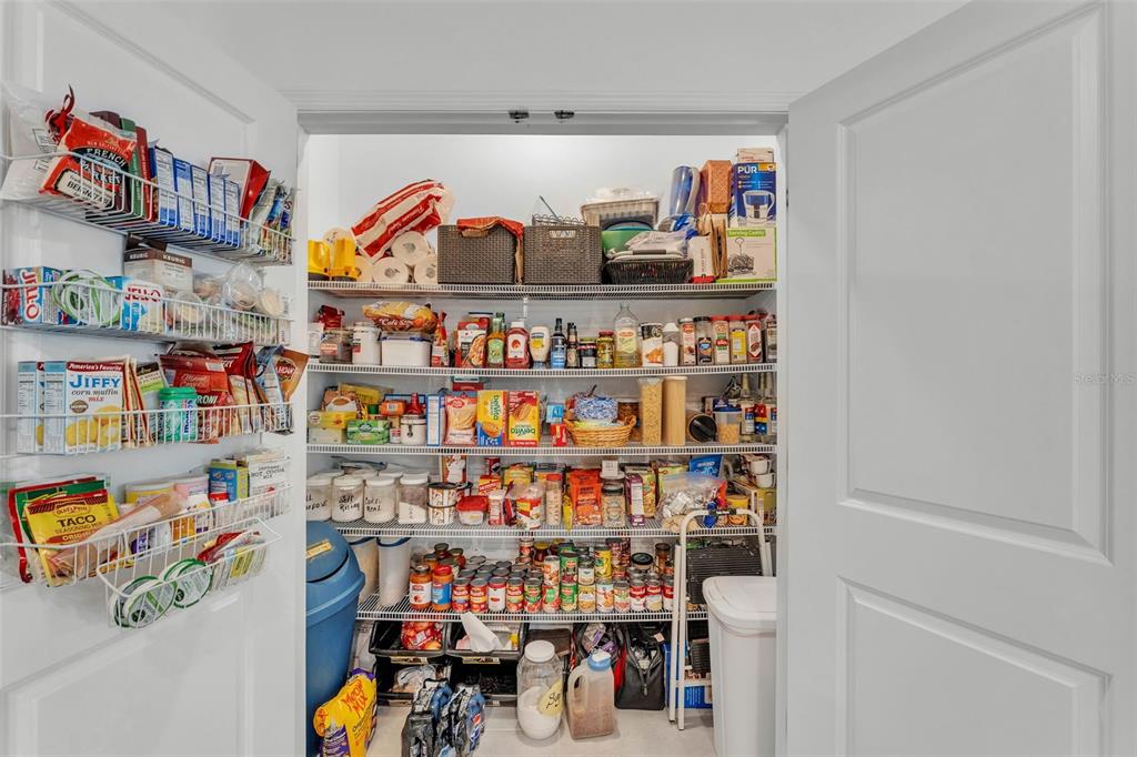 280 Pershing Street Bartow, FL 33830 - Photo 10 of 41 a store room with lots of clutter and a refrigerator