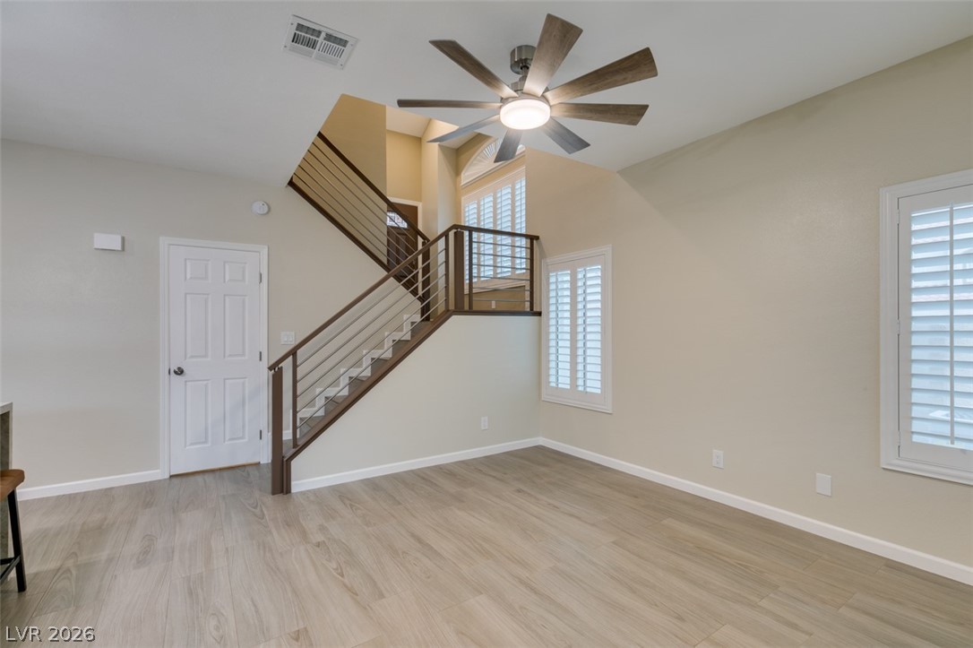 540 Sutters Mill Road Henderson, NV 89014 - Photo 16 of 46 This bright living space features modern flooring and a stylish staircase.