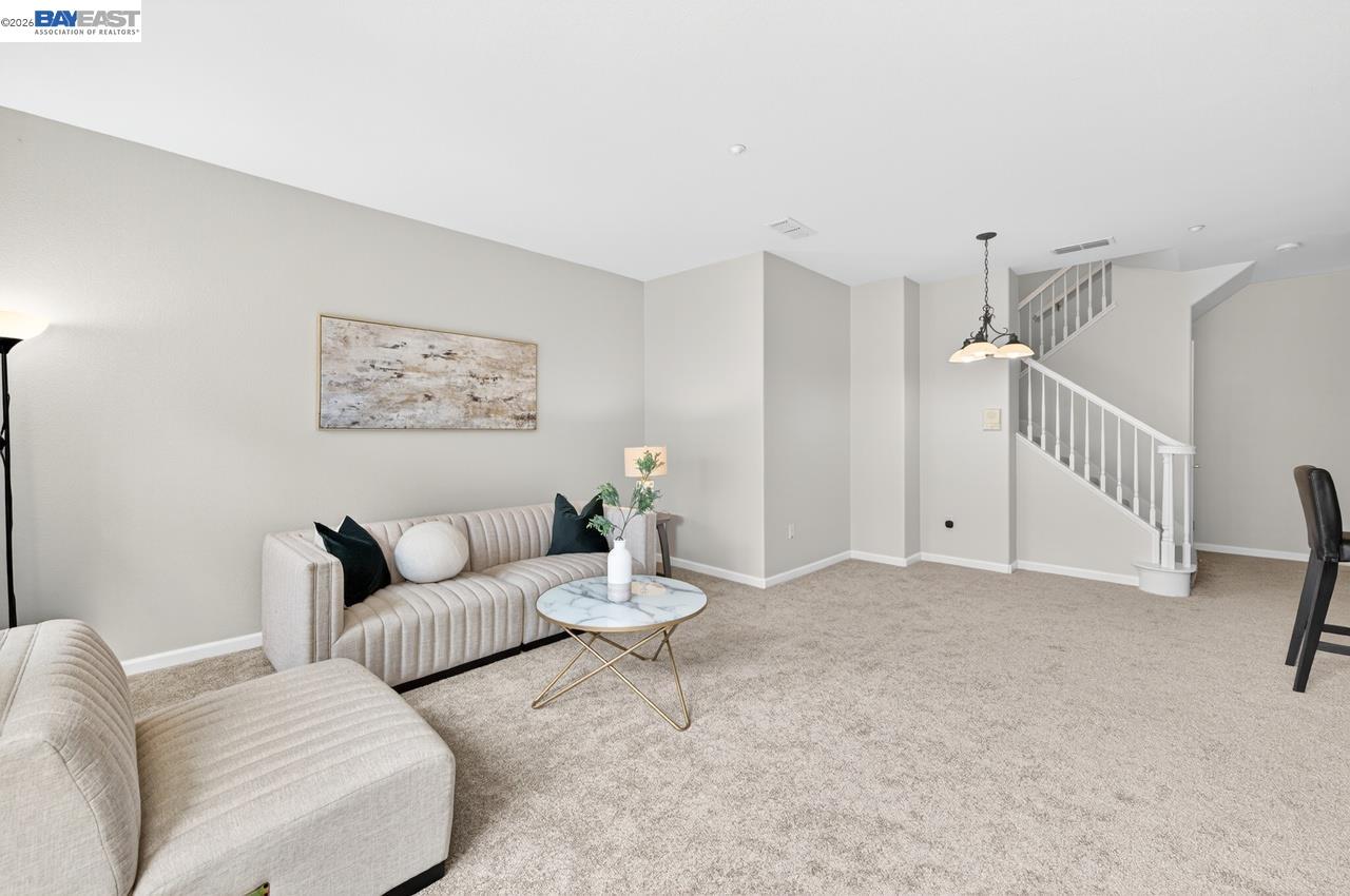 3391 Monaghan Street Dublin, CA 94568 - Photo 15 of 57 a living room with furniture and white walls