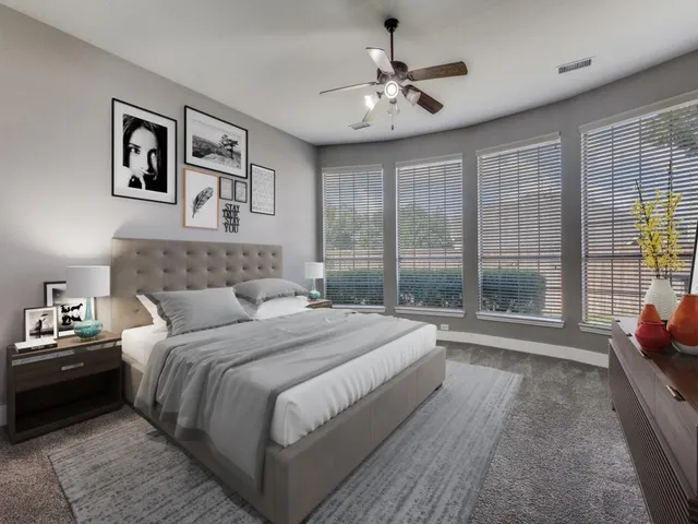 a bedroom with a large bed and a window