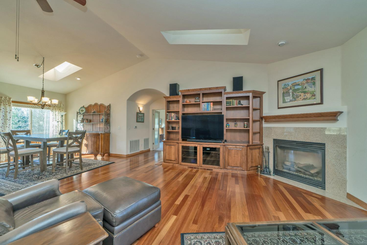 6510 Sly Park Road Placerville, CA 95667 - Photo 12 of 50 a living room with furniture a flat screen tv and a fireplace