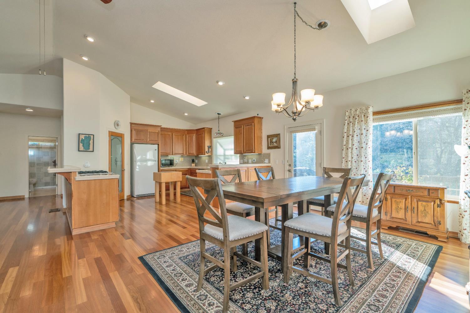 6510 Sly Park Road Placerville, CA 95667 - Photo 15 of 50 a view of a dining room with furniture window and wooden floor