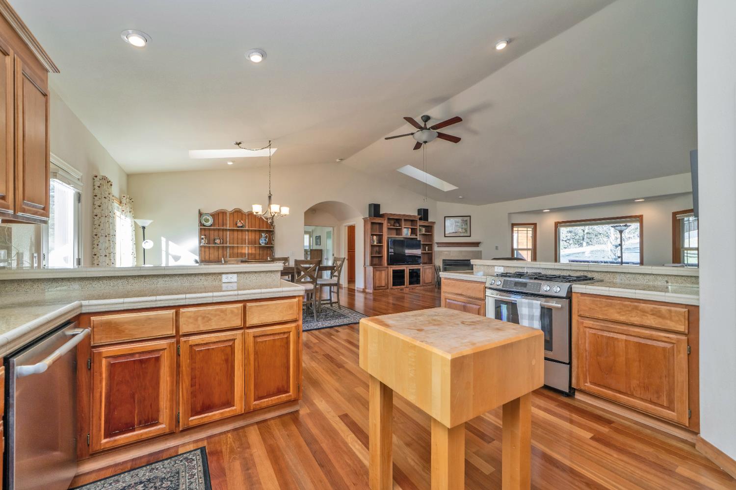 6510 Sly Park Road Placerville, CA 95667 - Photo 16 of 50 a kitchen with a stove a refrigerator and a stove top oven