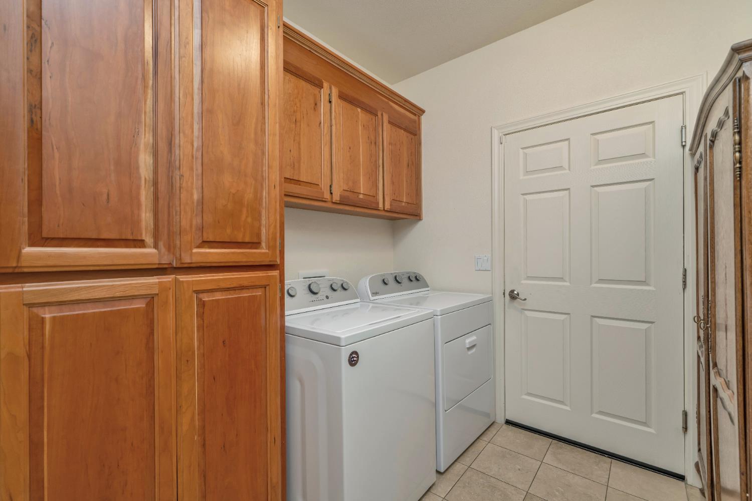 6510 Sly Park Road Placerville, CA 95667 - Photo 29 of 50 a view of cabinets and dryer