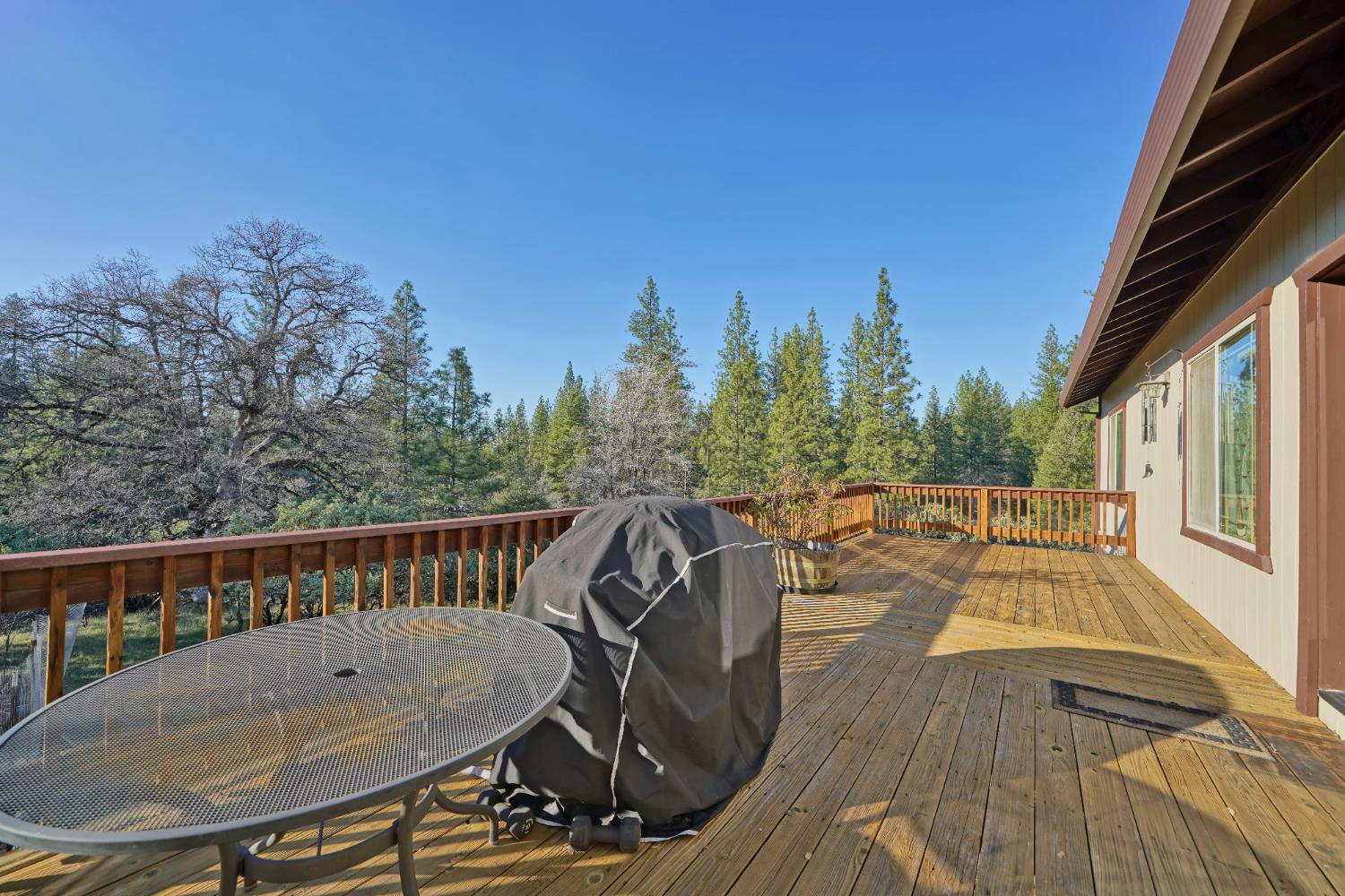 6510 Sly Park Road Placerville, CA 95667 - Photo 41 of 50 a view of a chairs and table on the roof deck