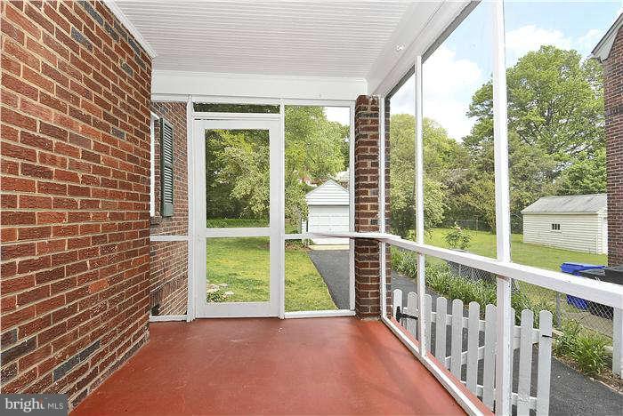 2807 South Arlington Ridge Road Arlington, VA 22202 - Photo 7 of 25 a view of porch with a floor to ceiling window and wooden fence
