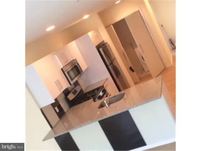 a view of living room with washer and dryer