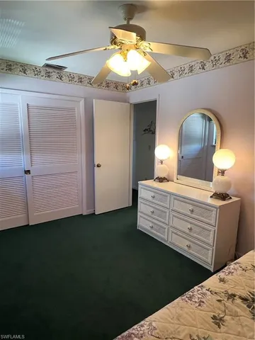 a bed room with a bed and a chandelier