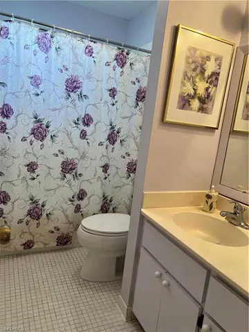 a bathroom with a sink and toilet
