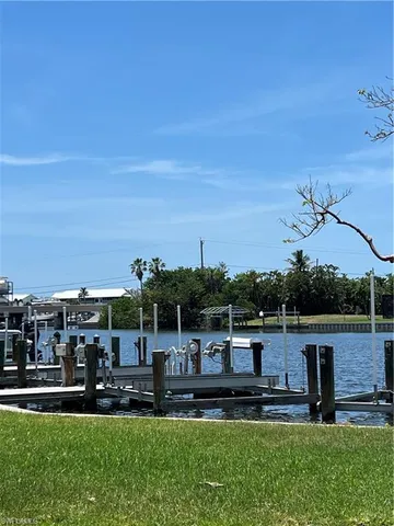 a view of a lake with a yard