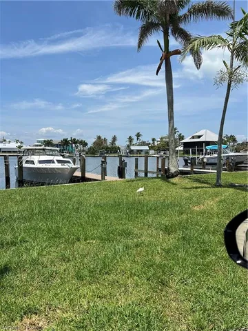 a view of a swimming pool and lounge chairs