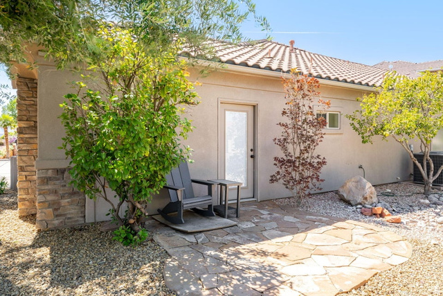 1609 East 10 S Street St. George, UT 84790 - Photo 50 of 68 Exterior patio area featuring flagstone paving, gravel landscaping, and mature trees