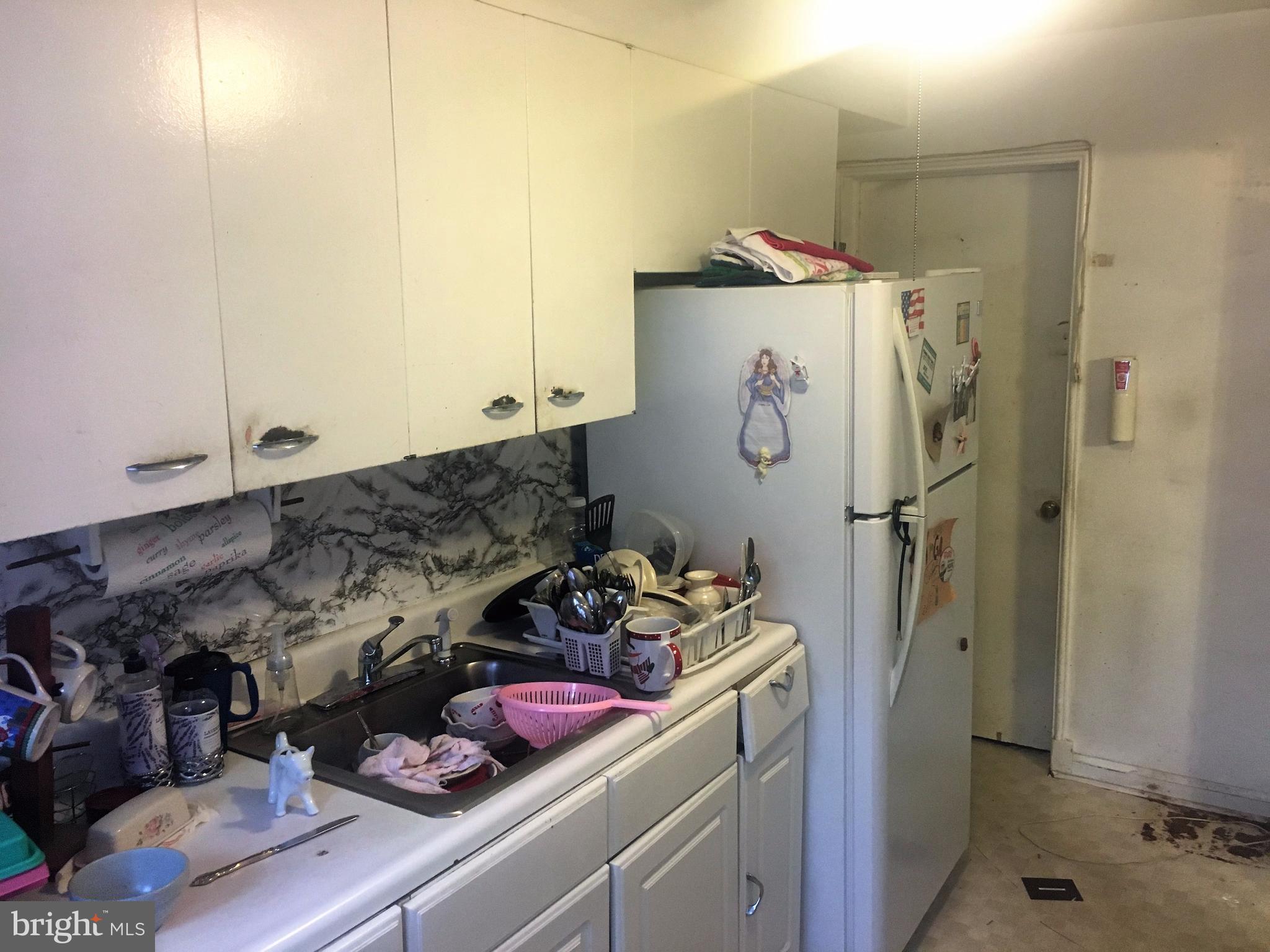 745 Aldworth Road Baltimore, MD 21222 - Photo 5 of 11 a bathroom with a shower and a sink