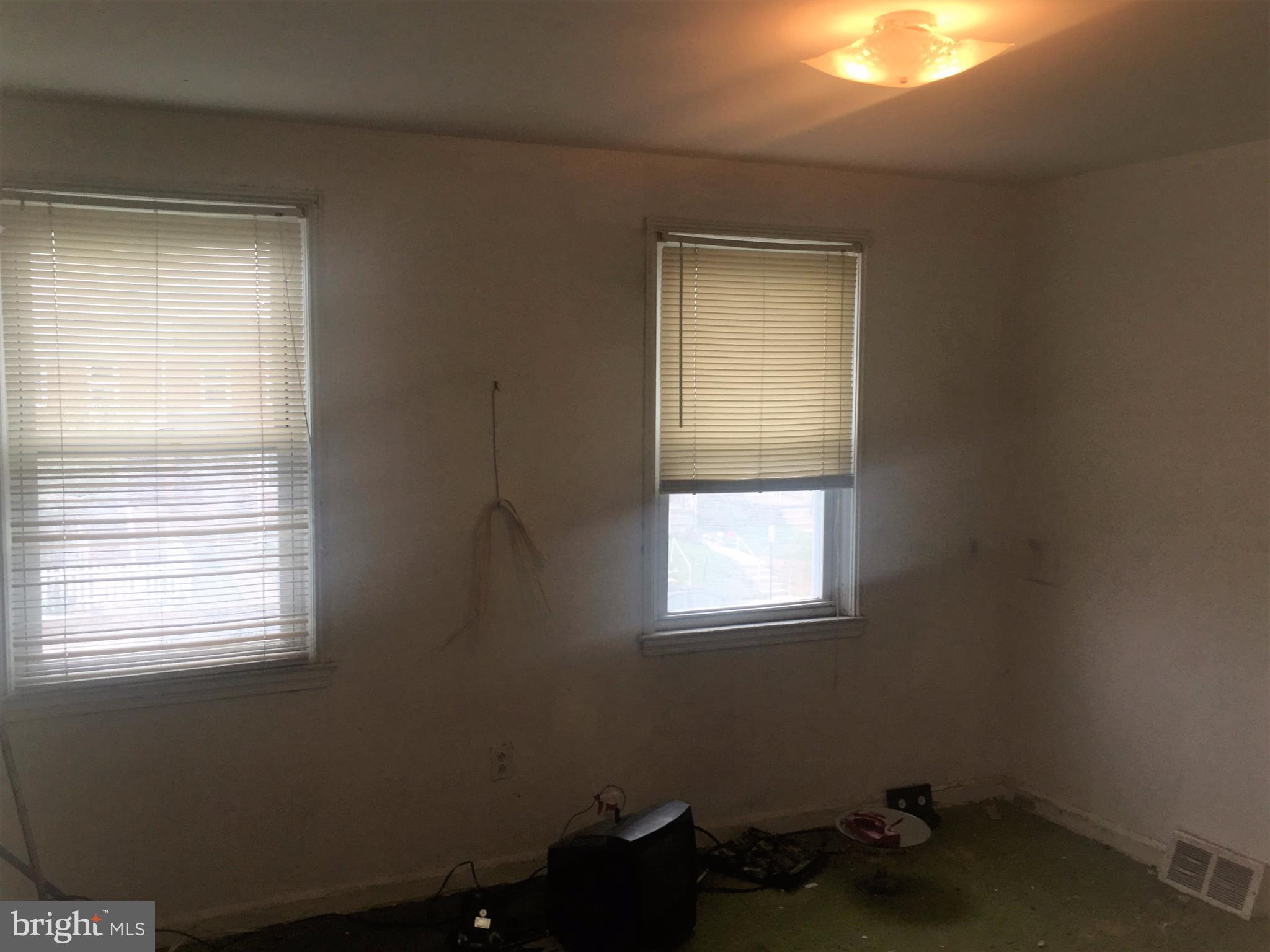 745 Aldworth Road Baltimore, MD 21222 - Photo 7 of 11 a room with a window