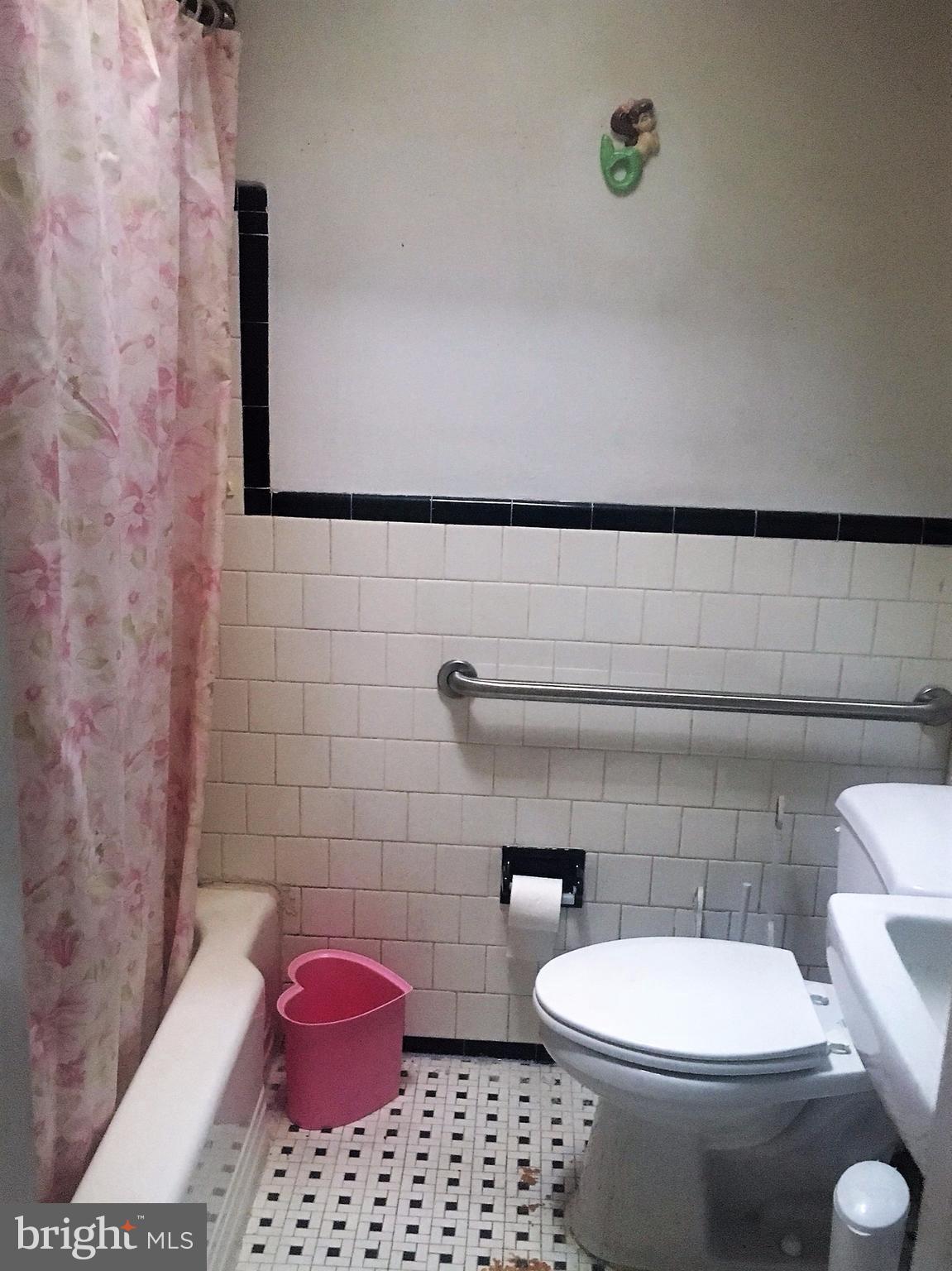 745 Aldworth Road Baltimore, MD 21222 - Photo 9 of 11 a bathroom with a toilet and a shower