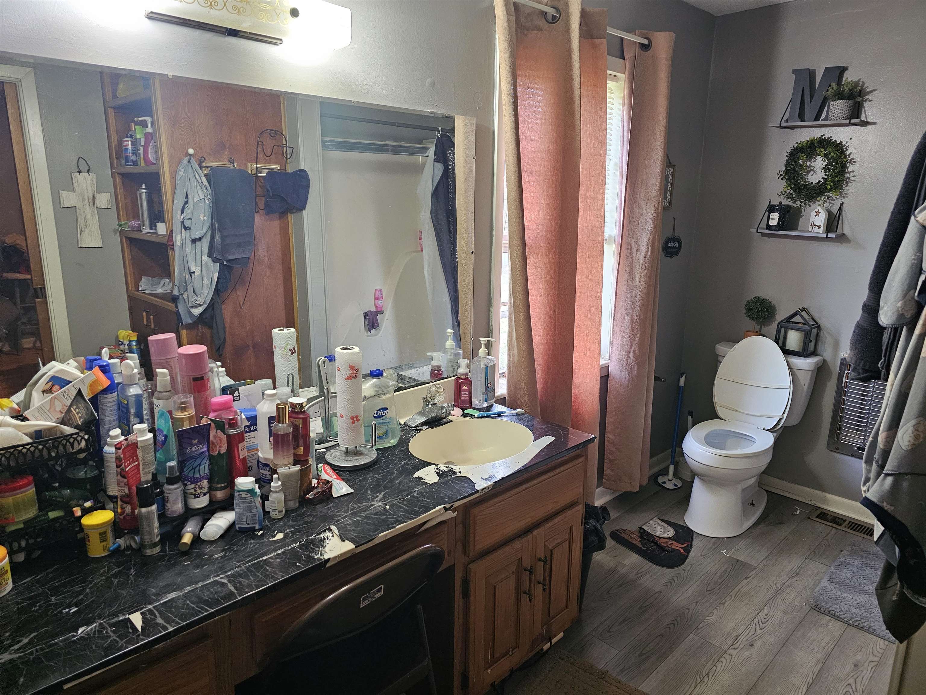 488 Perkins Street Ripley, TN 38063 - Photo 11 of 23 a bathroom with a granite countertop sink a toilet and a mirror
