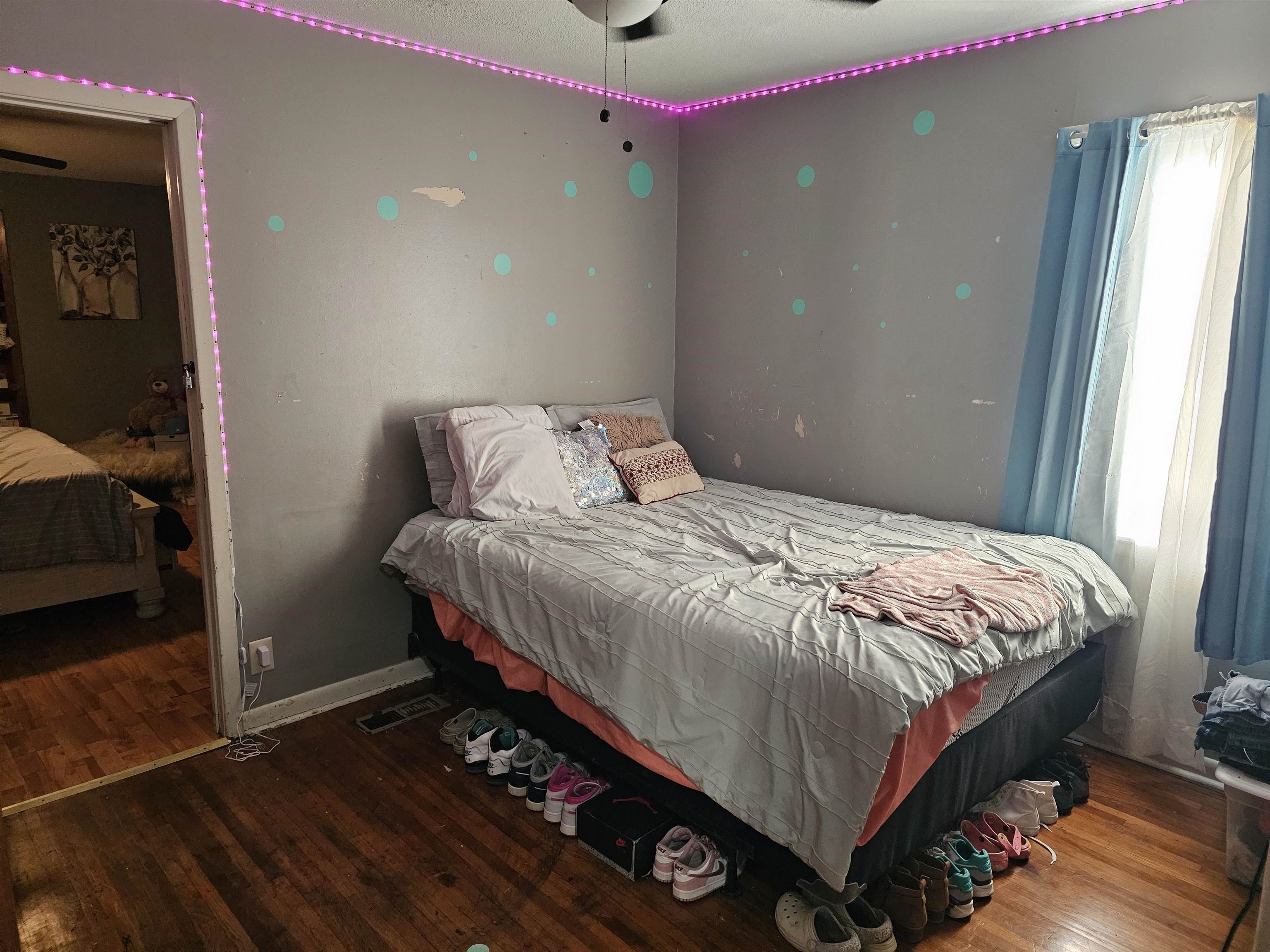 488 Perkins Street Ripley, TN 38063 - Photo 13 of 23 a bed sitting in a bedroom next to a window