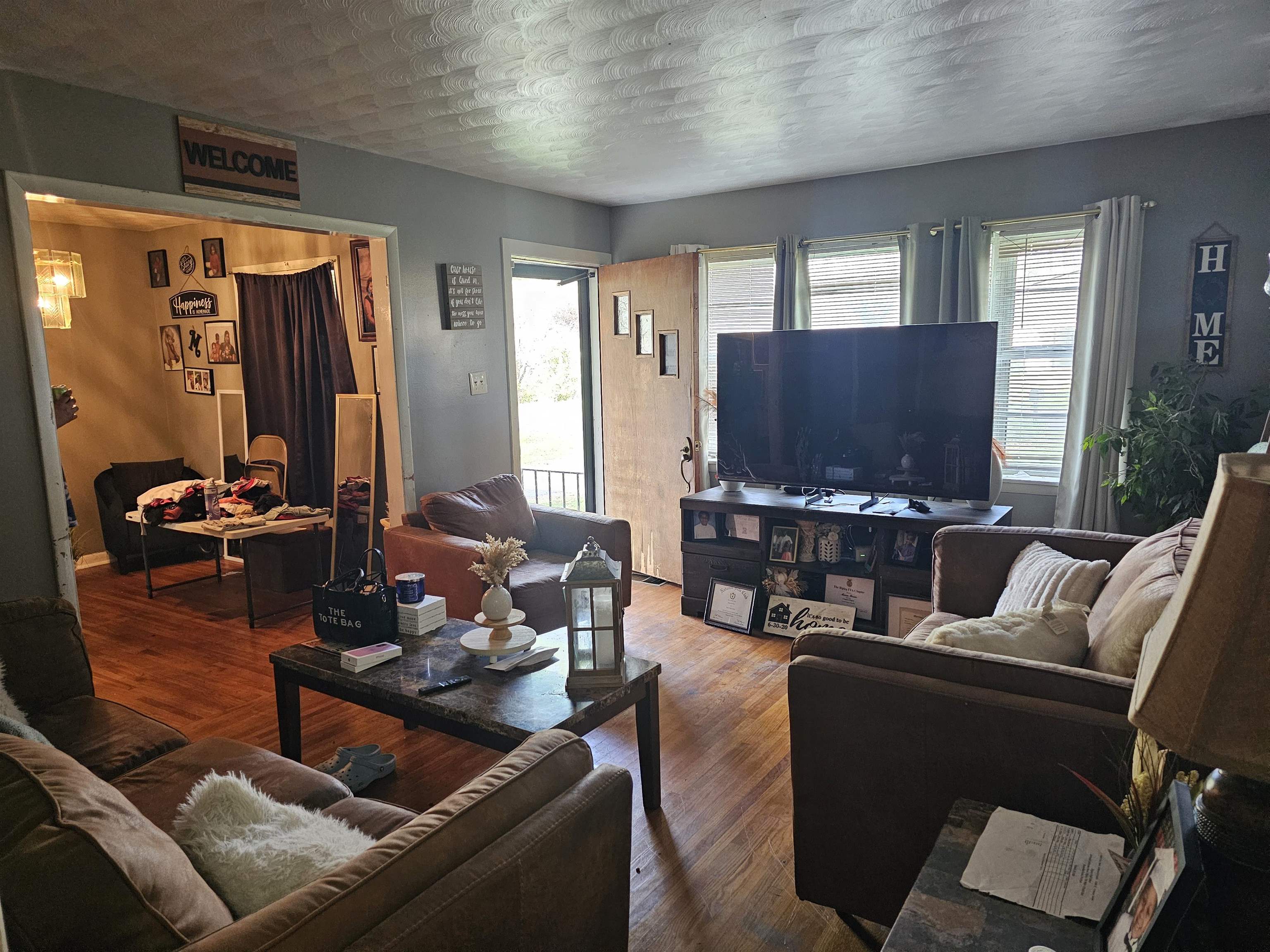 488 Perkins Street Ripley, TN 38063 - Photo 16 of 23 a living room with furniture and a flat screen tv