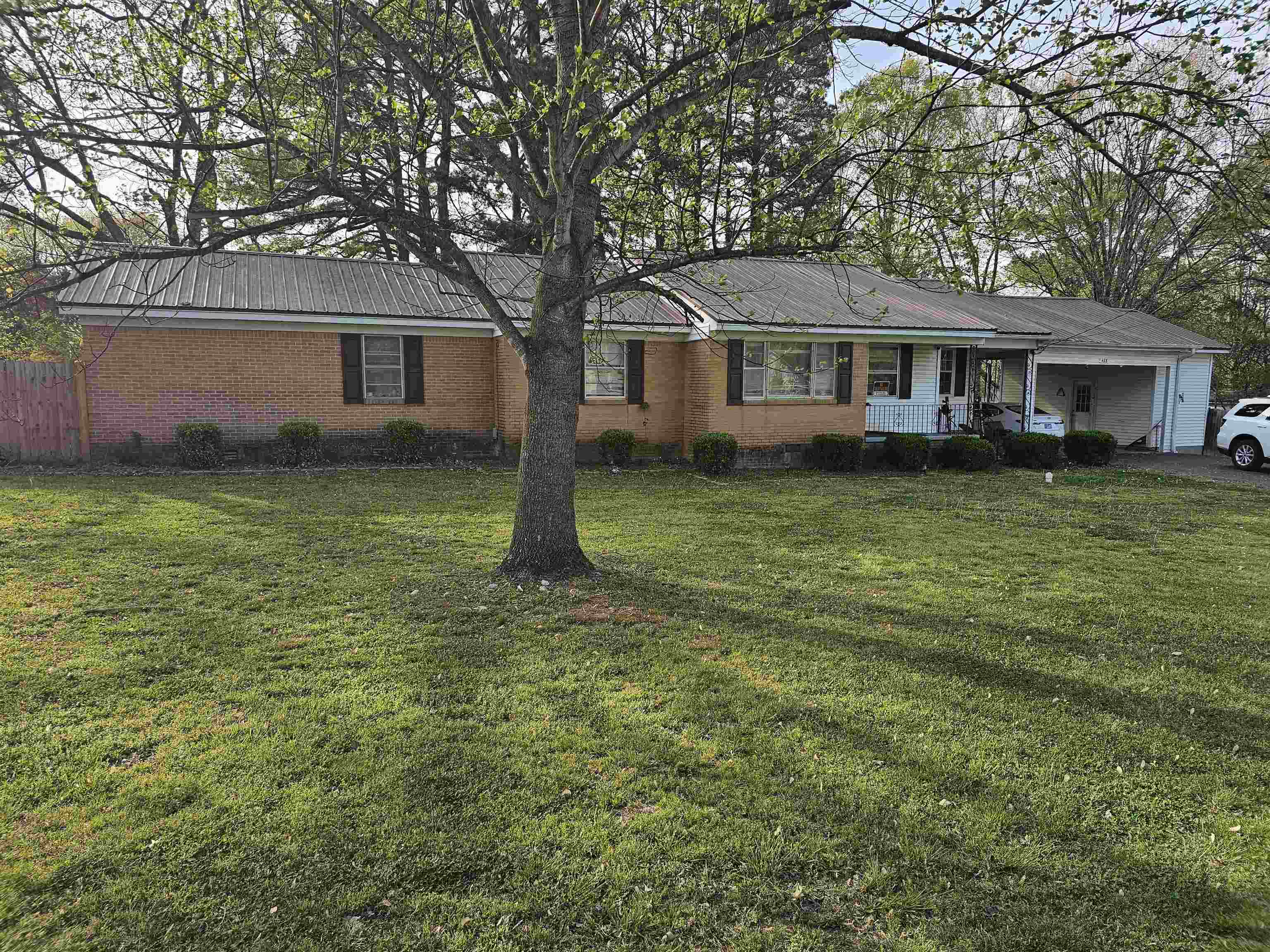 488 Perkins Street Ripley, TN 38063 - Photo 2 of 23 a front view of a house with garden