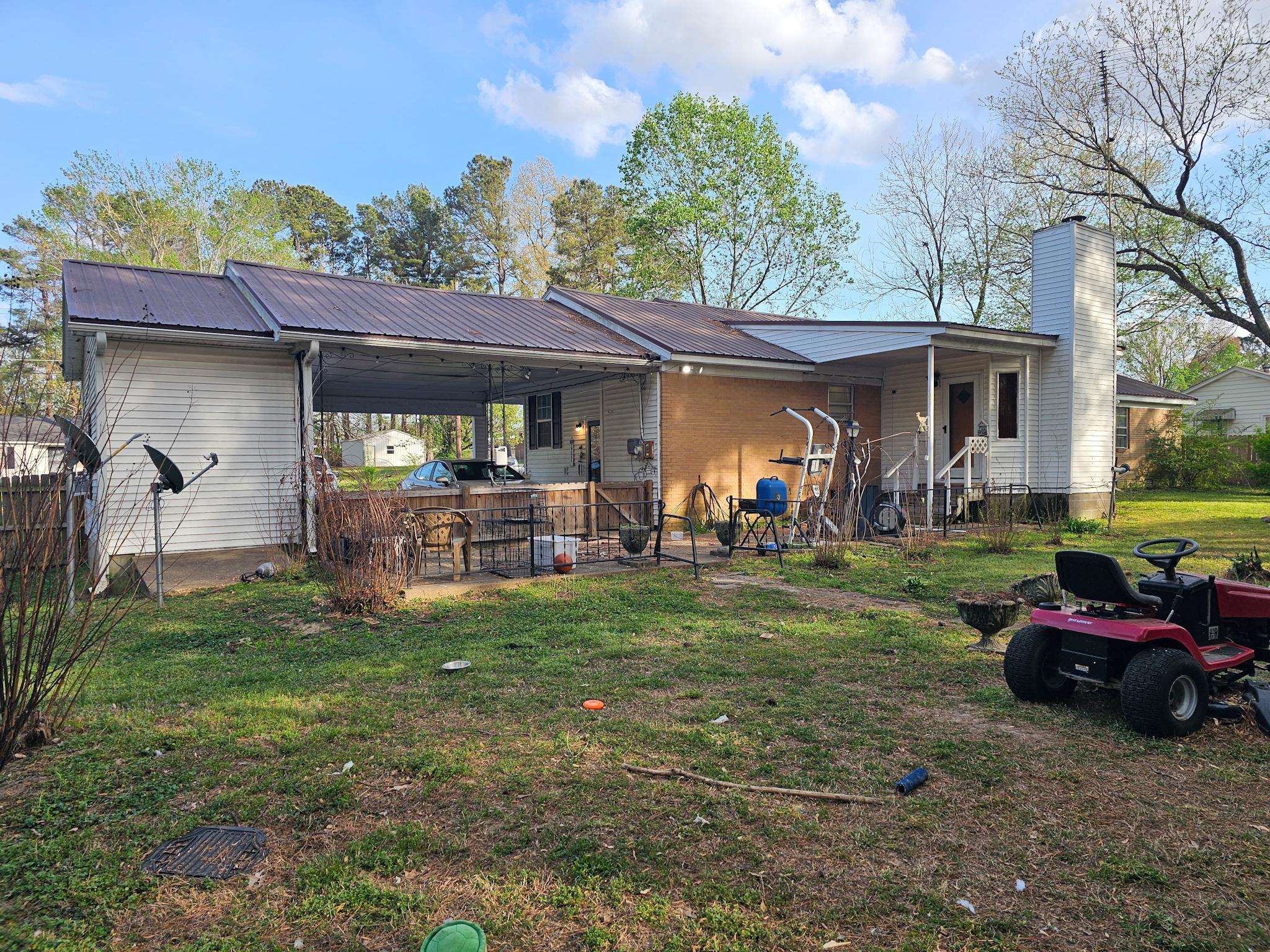 488 Perkins Street Ripley, TN 38063 - Photo 21 of 23 a front view of a house with garden