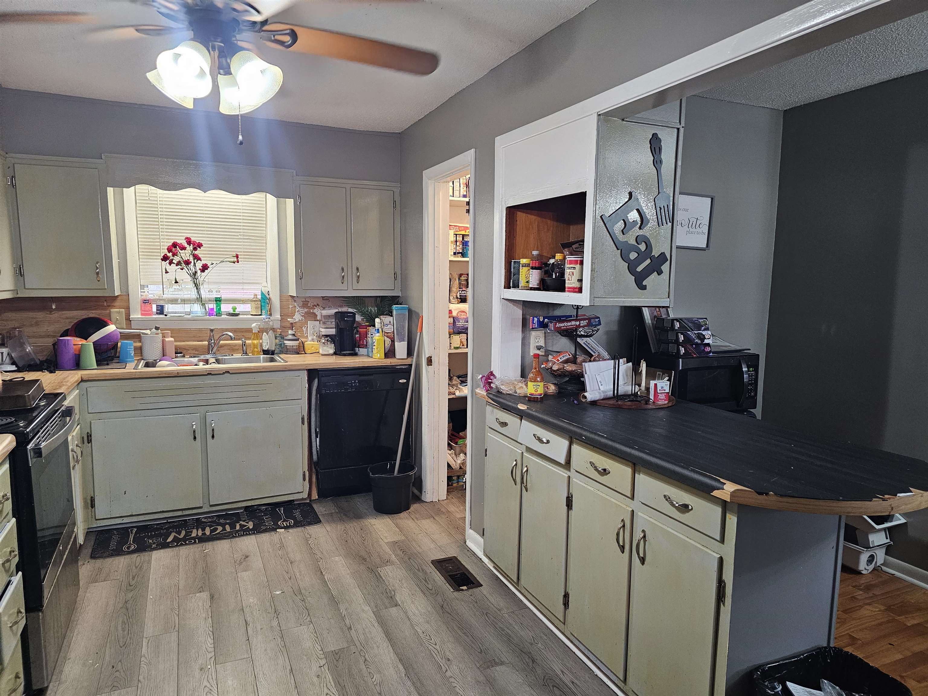488 Perkins Street Ripley, TN 38063 - Photo 4 of 23 a kitchen with a sink cabinets and window