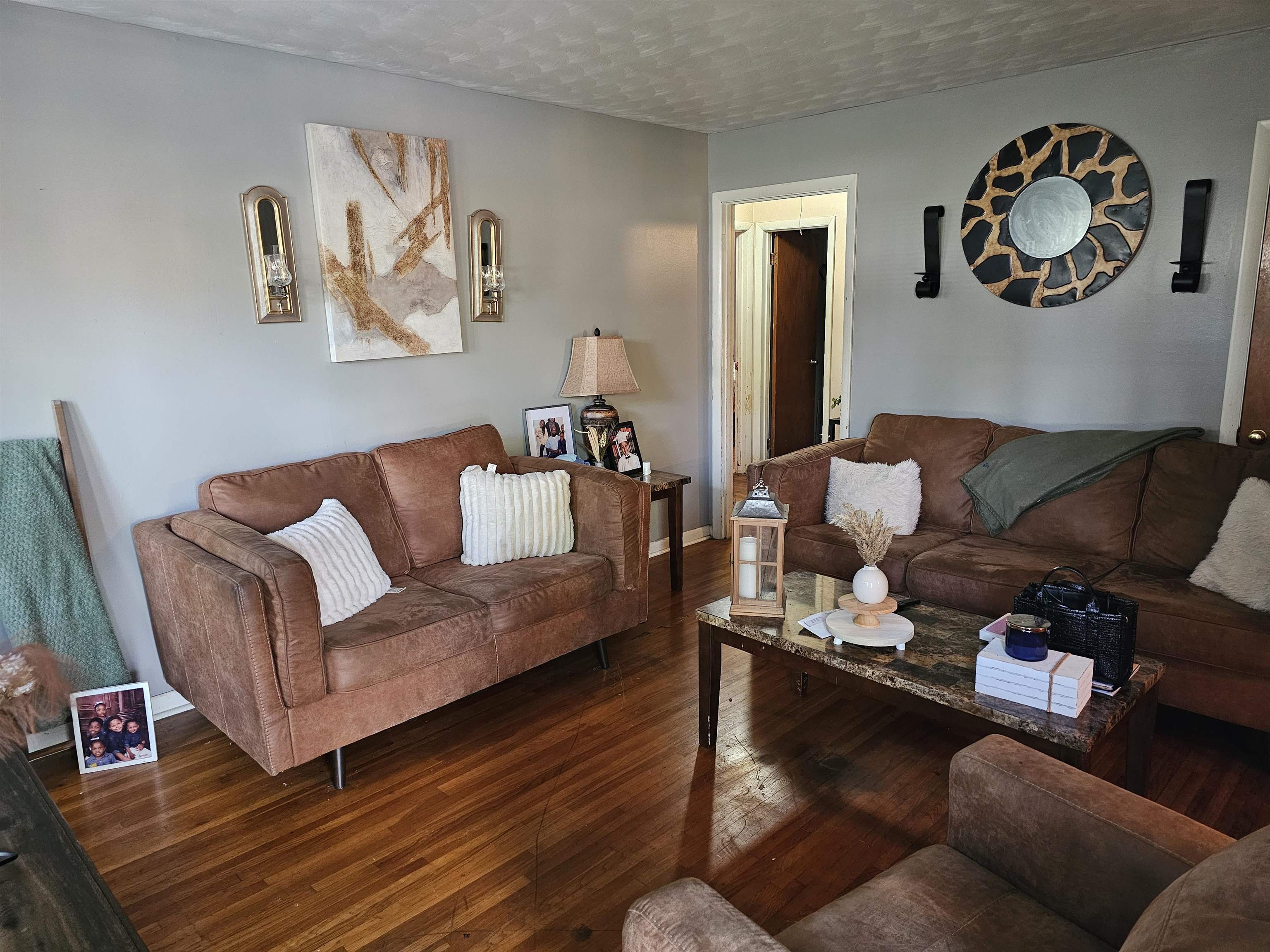 488 Perkins Street Ripley, TN 38063 - Photo 5 of 23 a living room with furniture and wall paintings