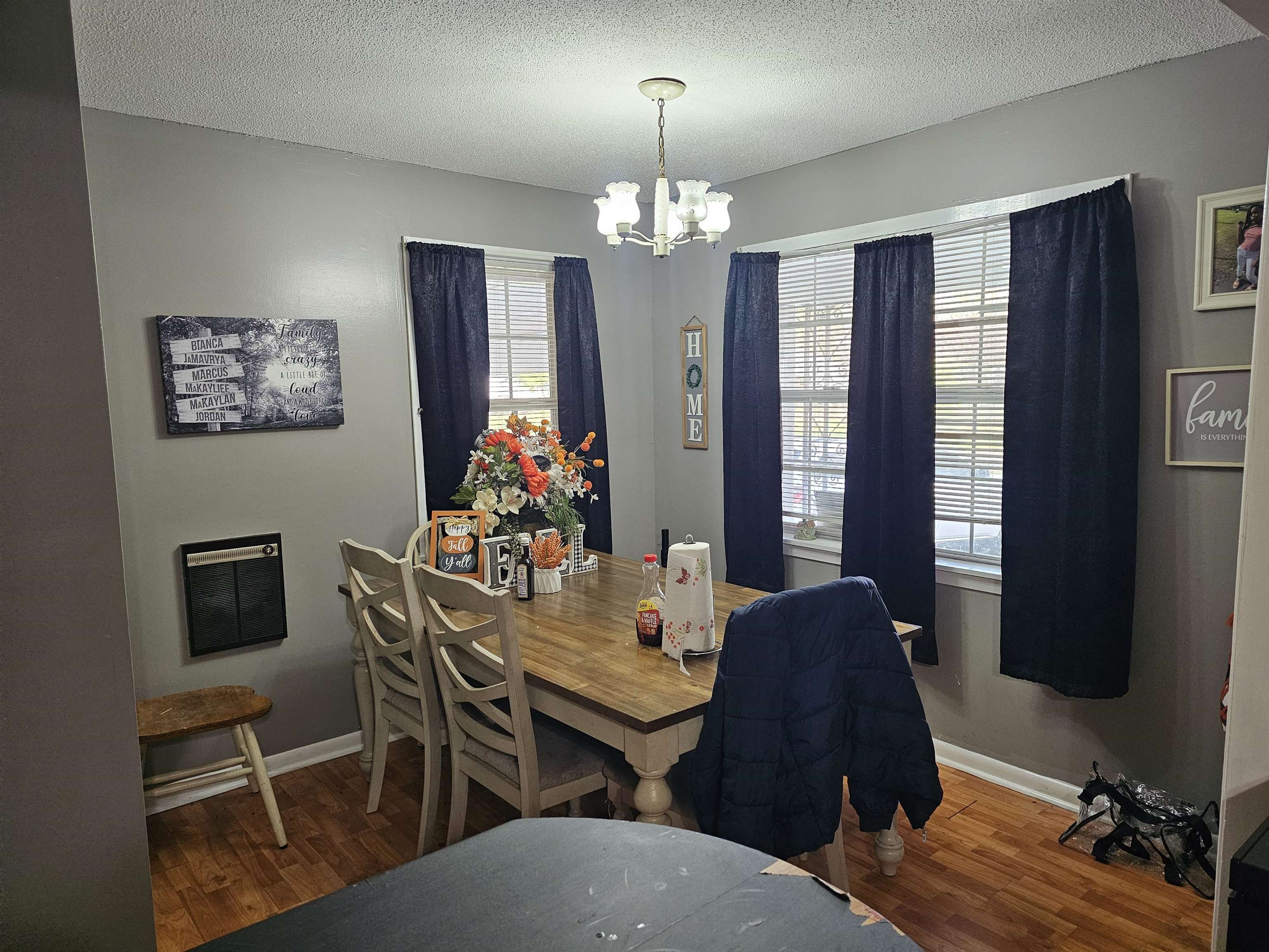 488 Perkins Street Ripley, TN 38063 - Photo 6 of 23 a view of a dining room with furniture a chandelier and wooden floor