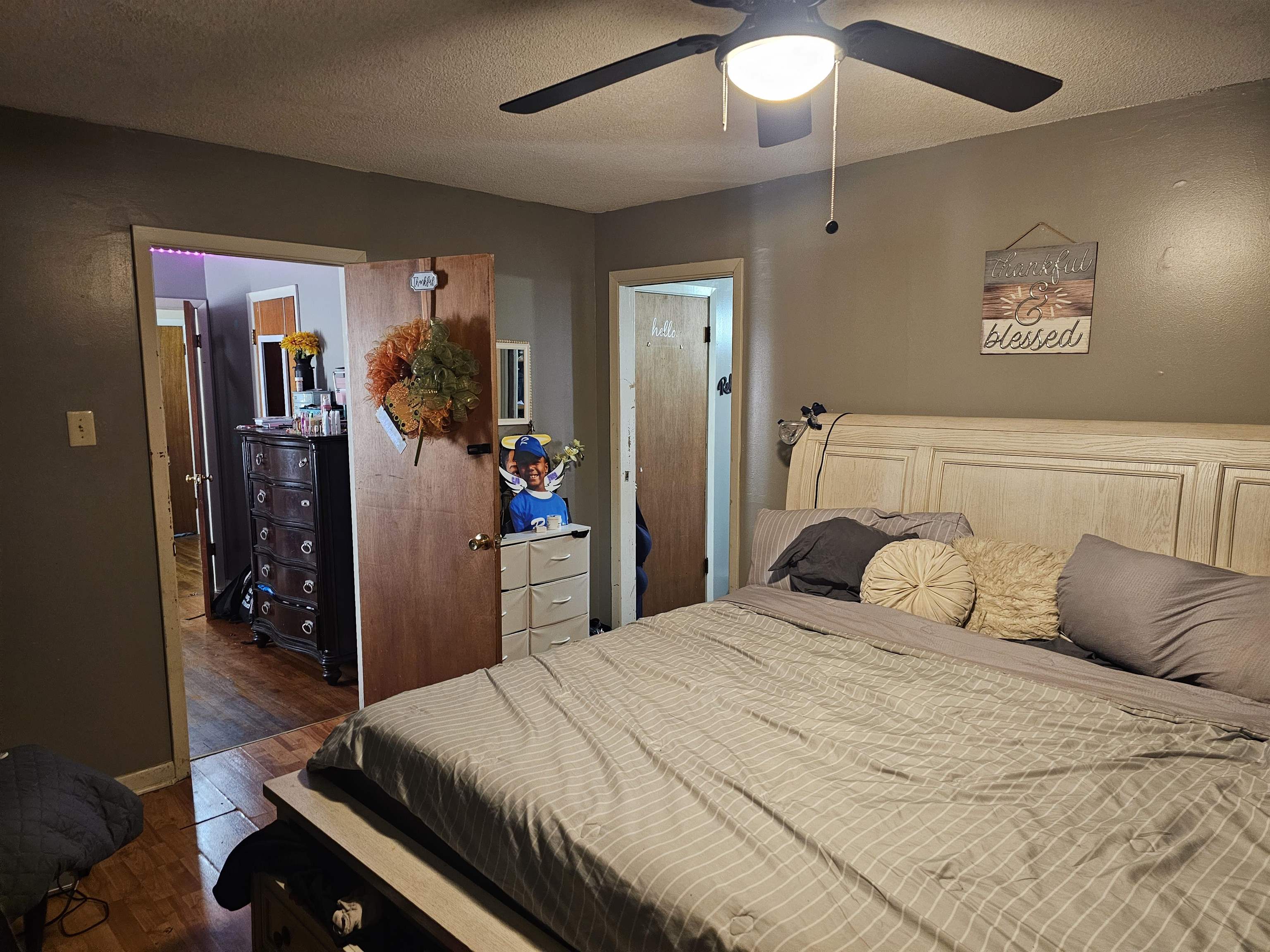 488 Perkins Street Ripley, TN 38063 - Photo 7 of 23 a bedroom with a bed and a chandelier