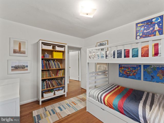 a living room with furniture cabinets and a book shelf