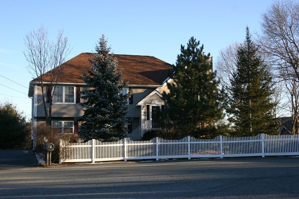 a view of a house and a yard