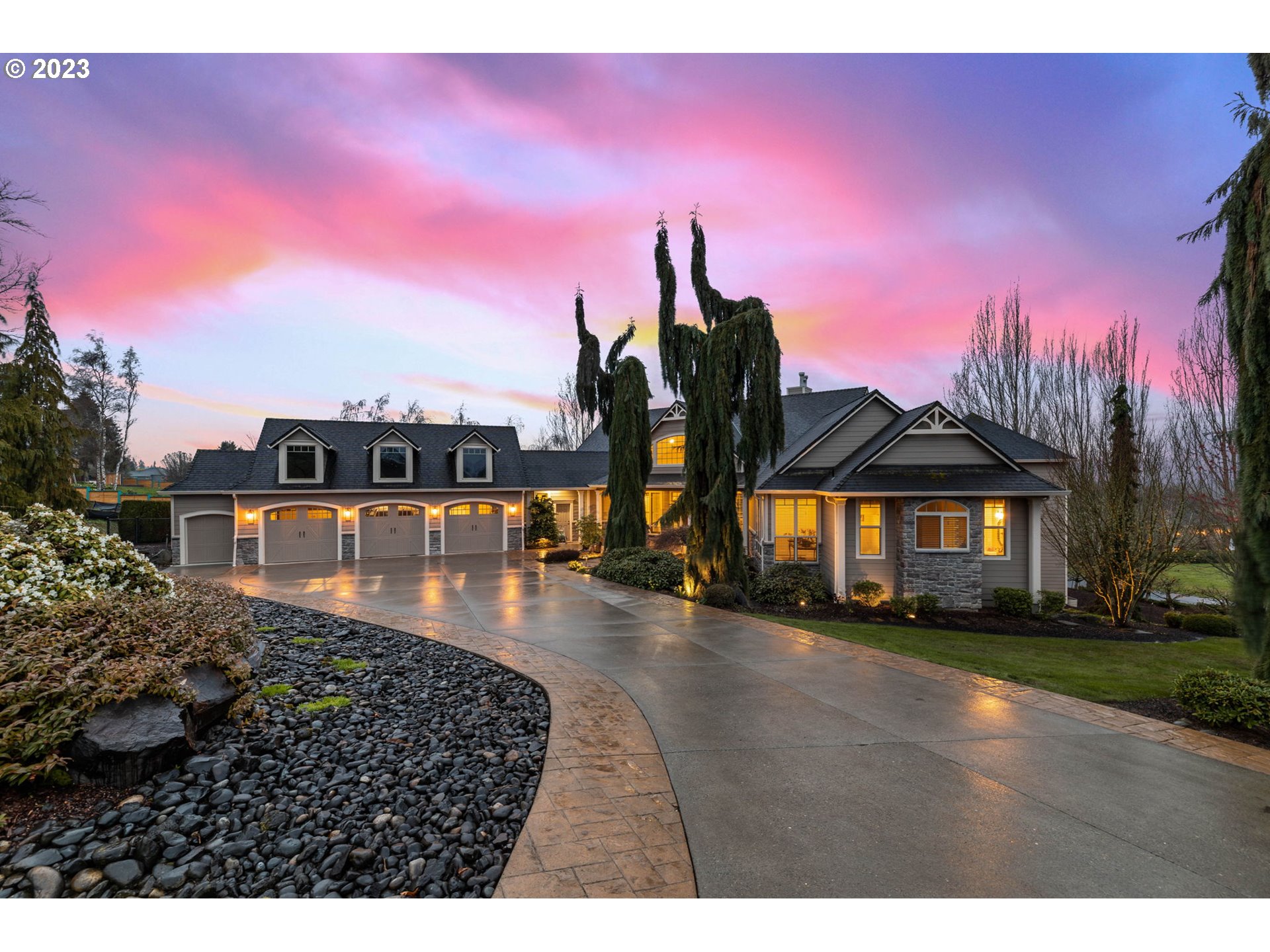 6405 Northwest 202nd Circle Ridgefield, WA 98642 - Photo 1 of 45 a front view of a house with a yard